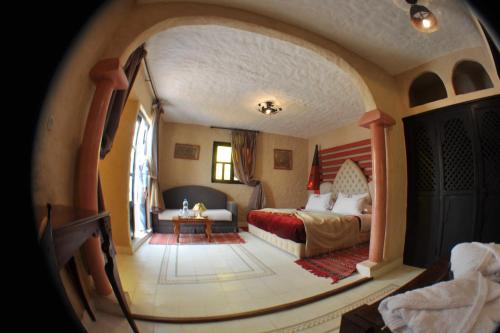 a hotel room with a bed and an american flag at Riad Al Madina in Essaouira