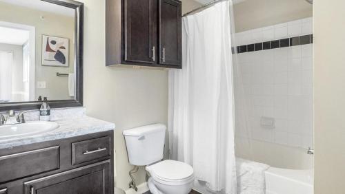 a bathroom with a toilet and a sink and a shower at Landing Modern Apartment with Amazing Amenities (ID7856X82) in Midlothian