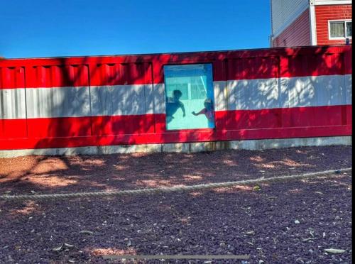 a wall with a painting of a shadow of a person on it at Iglú Simbad con vista al cielo in Barra de Navidad