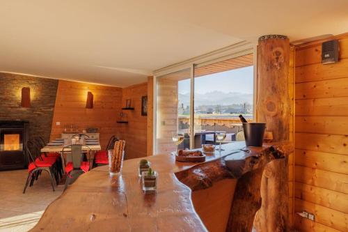 a large wooden table in a room with a dining room at Le Garage in Lorp Sentaraille