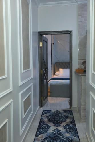 a door leading to a bedroom with a bed at Crystala guest house in Aswan