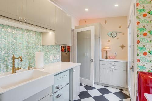 a kitchen with white cabinets and a checkered floor at Retro El Sobrante Apartment Near San Francisco! in El Sobrante