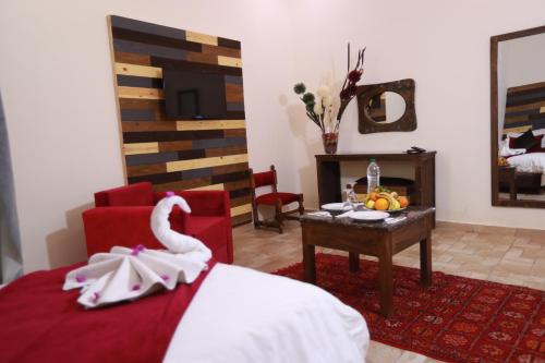Ein Bett oder Betten in einem Zimmer der Unterkunft Kasbah Tizimi