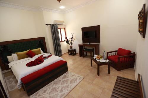 Ein Bett oder Betten in einem Zimmer der Unterkunft Kasbah Tizimi