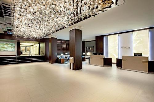 a lobby of a hotel with a chandelier at The Westin Portland Harborview in Portland