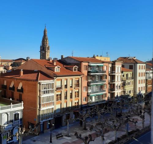 a group of buildings in a city with a clock tower at Villa- Belen in Santo Domingo de la Calzada