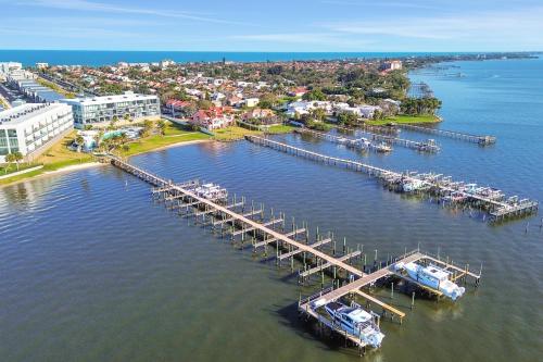 an aerial view of a marina with boats in the water at The Pearly Palm in Melbourne Beach