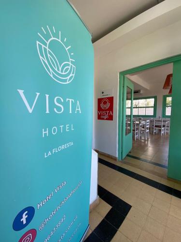a sign for a hotel in front of a building at Hotel Vista La Floresta in La Floresta