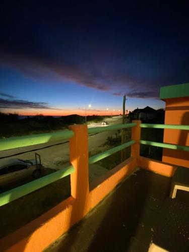 a view from the balcony of a house with a fence at Hotel Vista La Floresta in La Floresta