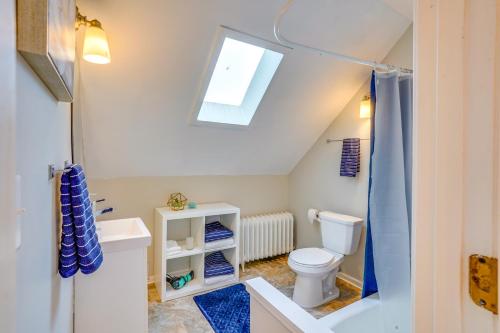 a bathroom with a toilet and a skylight at Pet-Friendly Minneapolis Apartment Near Downtown! in Minneapolis
