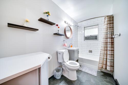 a bathroom with a toilet and a sink and a shower at Quaint Renton Home about 15 Mi to Downtown Seattle! in Renton