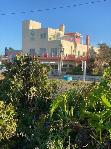 a building with a lot of plants in front of it at Hotel Vista La Floresta in La Floresta