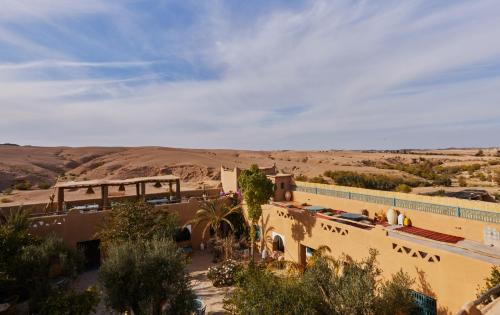 a view of a building in the desert at Agafay Desert Hotel in El Karia