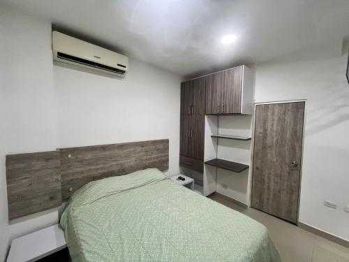 En eller flere senge i et værelse på Apto Amoblado Alameda Cali