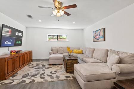 a living room with a couch and a ceiling fan at 3 Living Rooms - Spacious - Family-Friendly in National City