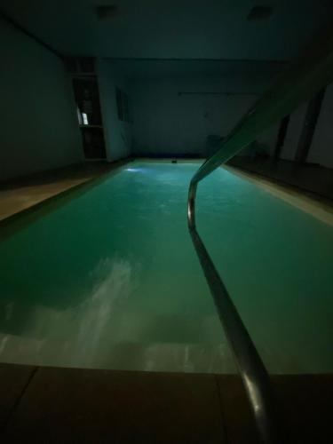 an empty swimming pool in a dark room at Hotel Vista La Floresta in La Floresta