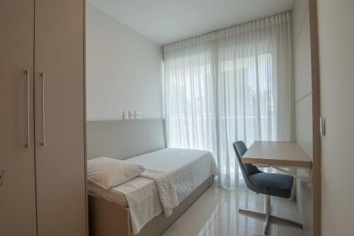 Ένα ή περισσότερα κρεβάτια σε δωμάτιο στο Starlis Home - Versátil