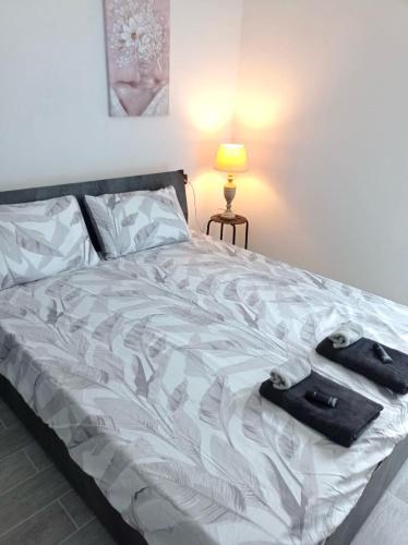 a bedroom with a bed with a suitcase on it at Case vacanze Rosa in Siniscola