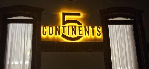 a continents sign on the side of a building at Hotel 5 Continents in Craiova