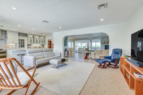 a living room with a couch and a table at Waterfront Palmetto Home with Private Pool and Dock! in Palmetto