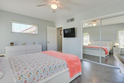 a bedroom with two beds and a ceiling fan at Waterfront Palmetto Home with Private Pool and Dock! in Palmetto