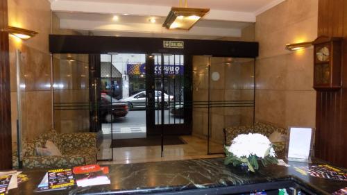 a lobby with a entrance to a building with a glass door at Mayflower Suites in Buenos Aires