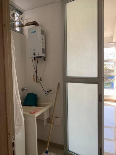 a small room with a sink and a window at Apartaestudio Jacuzzi Centro Comercial Gimnasio ALTOPRADO in Barranquilla