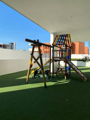 a playground with a slide on a roof at Apartaestudio Jacuzzi Centro Comercial Gimnasio ALTOPRADO in Barranquilla
