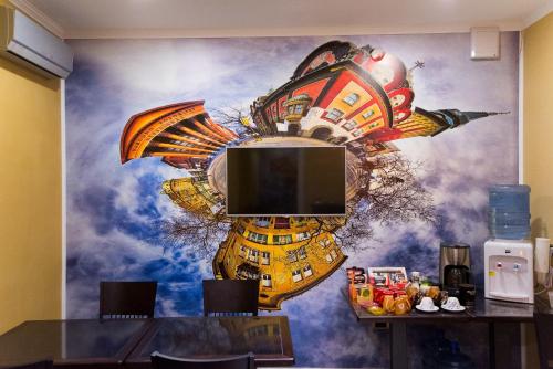 a wall with a mural of a space shuttle at Guest house Mali hotel in Subotica