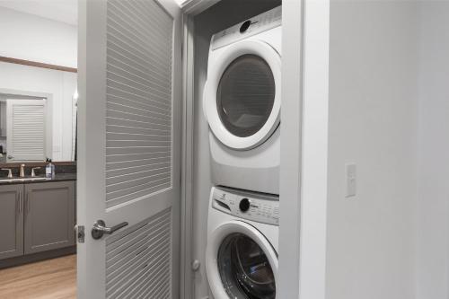 a laundry room with a washer and dryer at Charming 1BR 1BA Apartment Near Downtown Cincinnati in Cincinnati
