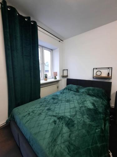 Posteľ alebo postele v izbe v ubytovaní Apartament Green Prince
