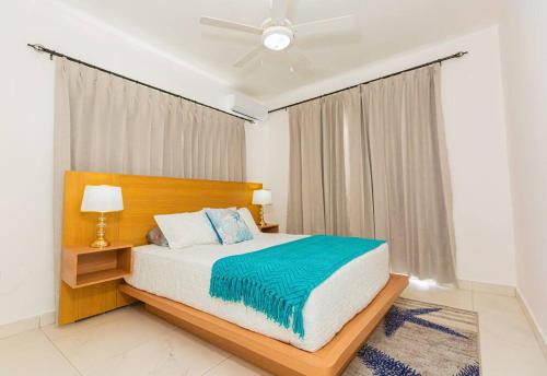 a bedroom with a bed and a ceiling fan at Villa Cancu, 2 bd, 2.5 bath, wi-fi, pool, Parking in Cabarete