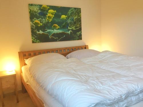 Postel nebo postele na pokoji v ubytování Kurparkcarree - Ferienwohnung "Amber"