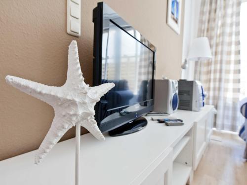 Una televisión o centro de entretenimiento en _ARW3_ _ Ferienwohnung Kossmann