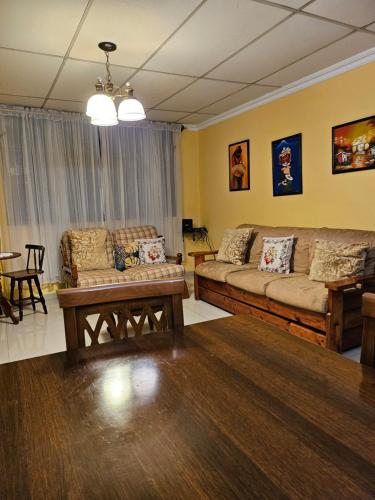 a living room with a couch and a table at Apartaments Malecon 2000 in Guayaquil