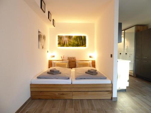a bedroom with a bed in a room at Sunshine Winterberg Ferienwohnung Pool Sauna Terrasse Wifi in Winterberg