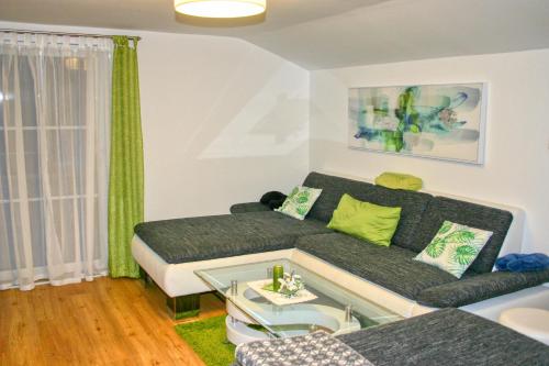 a living room with a couch and a table at Apartment Birke 1 - by Alpen Apartments in Bad Gastein