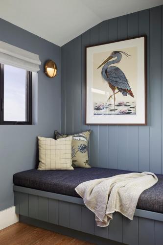 a bedroom with a bird sitting on a bed at The Lodge at Bodega Bay in Bodega Bay