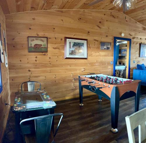 a play room with a table and a game board at Blue Beary Delight Newly renovated Near Everything in Sevierville