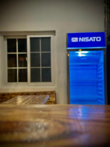 a blue nissato box sitting next to a building at Blasina el valle in Valle de Anton