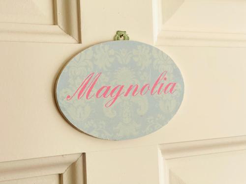 a sign that says margarita hanging on a wall at Villa28 Self-Check- in in Aarau