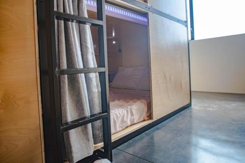 a room with a glass door with a bed inside at Haven Coliving in Los Angeles