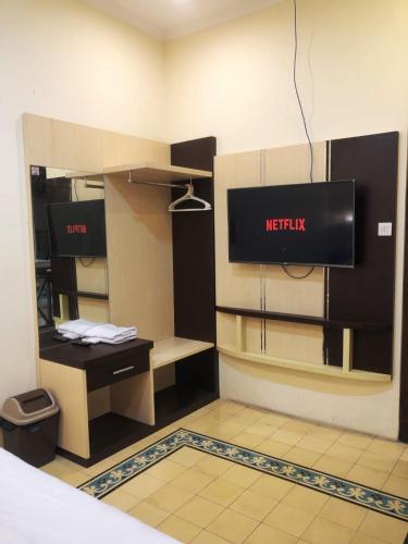 a waiting room with a netflix sign on the wall at Attanaya Malioboro Suites Yogyakarta in Sentool