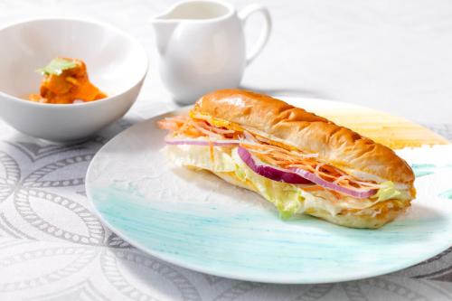 a sandwich on a plate on a table at パプリカホテルです in Kisarazu