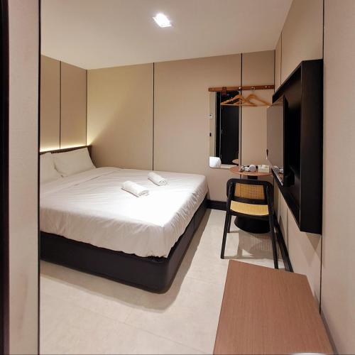 Ένα ή περισσότερα κρεβάτια σε δωμάτιο στο Urban Inn, Salak Tinggi
