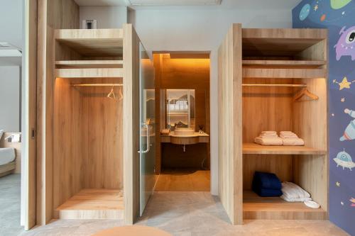 a room with a bathroom with a shower and a sink at Timberton Resort Khaoyai in Ban Tha Maprang