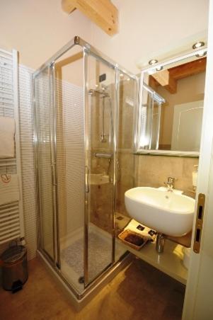 a bathroom with a shower and a sink at Tenuta Monaci La Murra in Carmiano