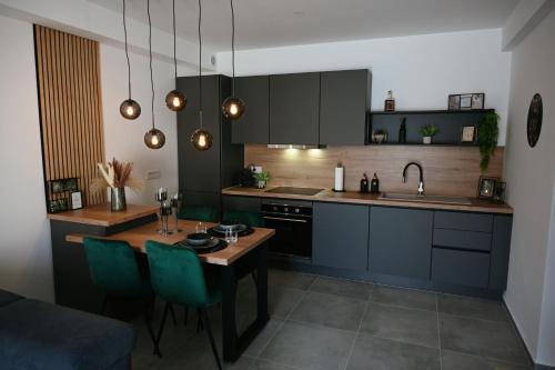 Kuchyň nebo kuchyňský kout v ubytování ADRIANIK Apartment