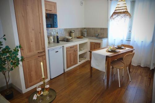 a kitchen with a table and a table and a candle at BALI DREAM, pour une escapade inoubliable! in Grenoble