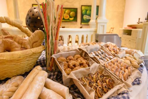 a table topped with lots of different types of food at Hotel Globales Camino Real Managua in Managua
